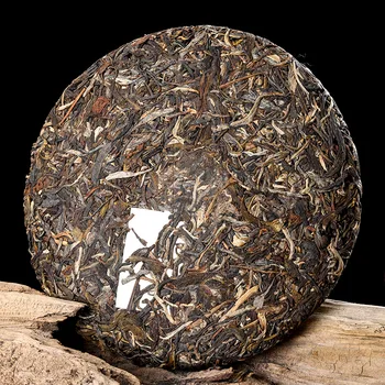 Juņnaņas Pu 'er Tea Pagatavotas Tējas Xishuangbanna 357g Qizi Tējas Kūka Vairumtirdzniecības Nannuoshan Veco Koku Tējas Izejvielas Tējas Yunnan Salocīts Izskats